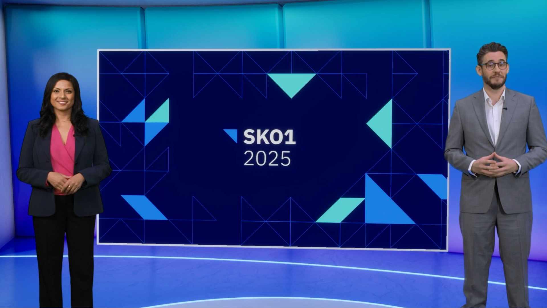 Presenters standing in a virtual news desk set in front of a virtual screen