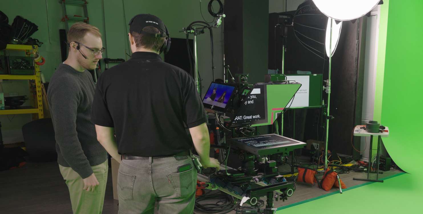 Picture of Luke working with the camera op for the event